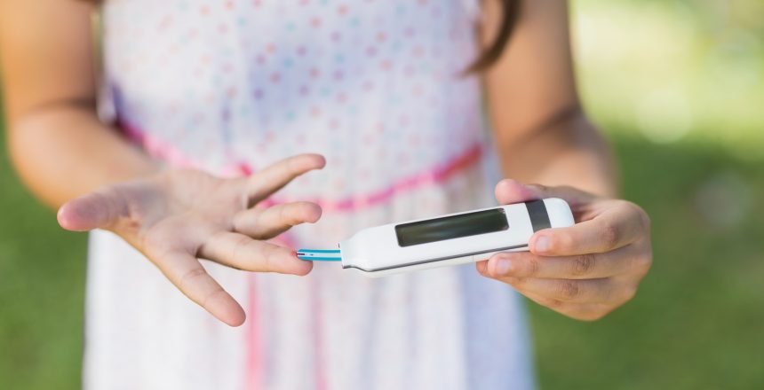 23701462_girl-testing-diabetes-on-glucose-meter